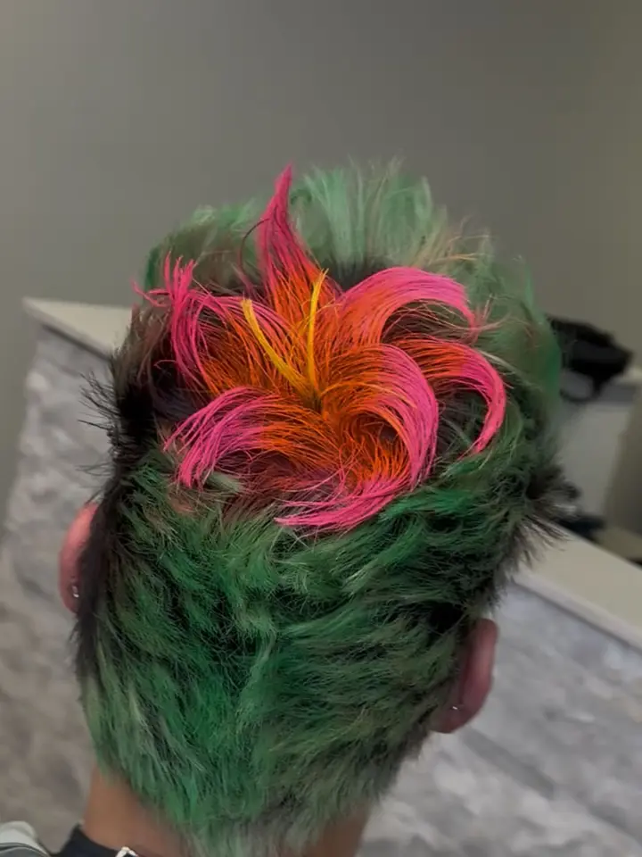 VividFusion neon hair color applied by a barber in a barbershop